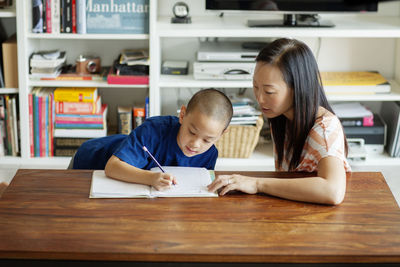 Boy studying at table