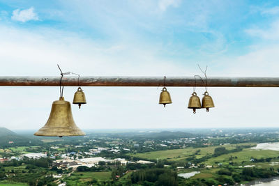 Scenic view of hanging from roof against sky