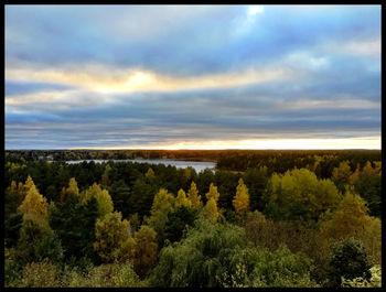 Scenic view of landscape against cloudy sky