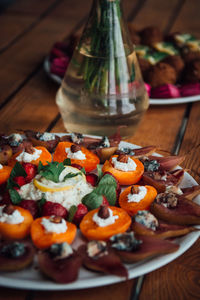 High angle view of fruits in plate on table