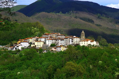 High angle view of townscape by mountain