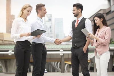 Group of people holding hands