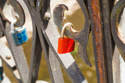 Close-up of padlocks on railing