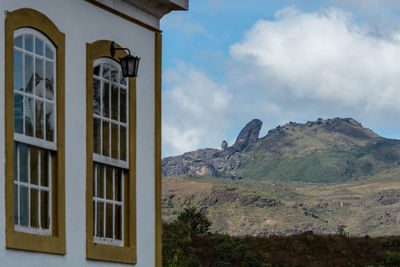 Built structure on mountain against sky