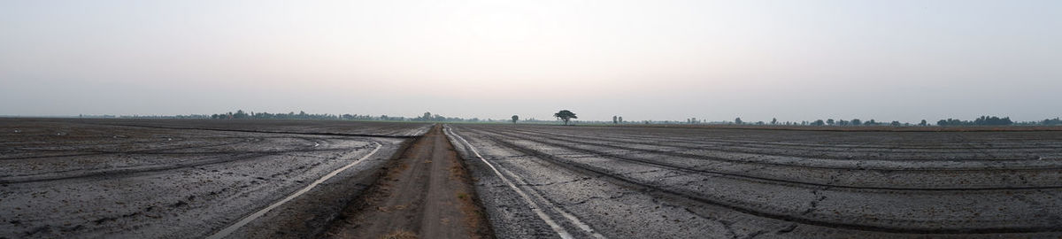 Surface level of railroad tracks against sky