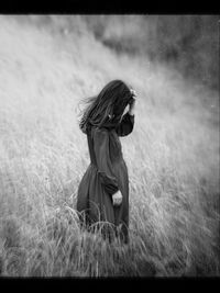 Woman standing on field