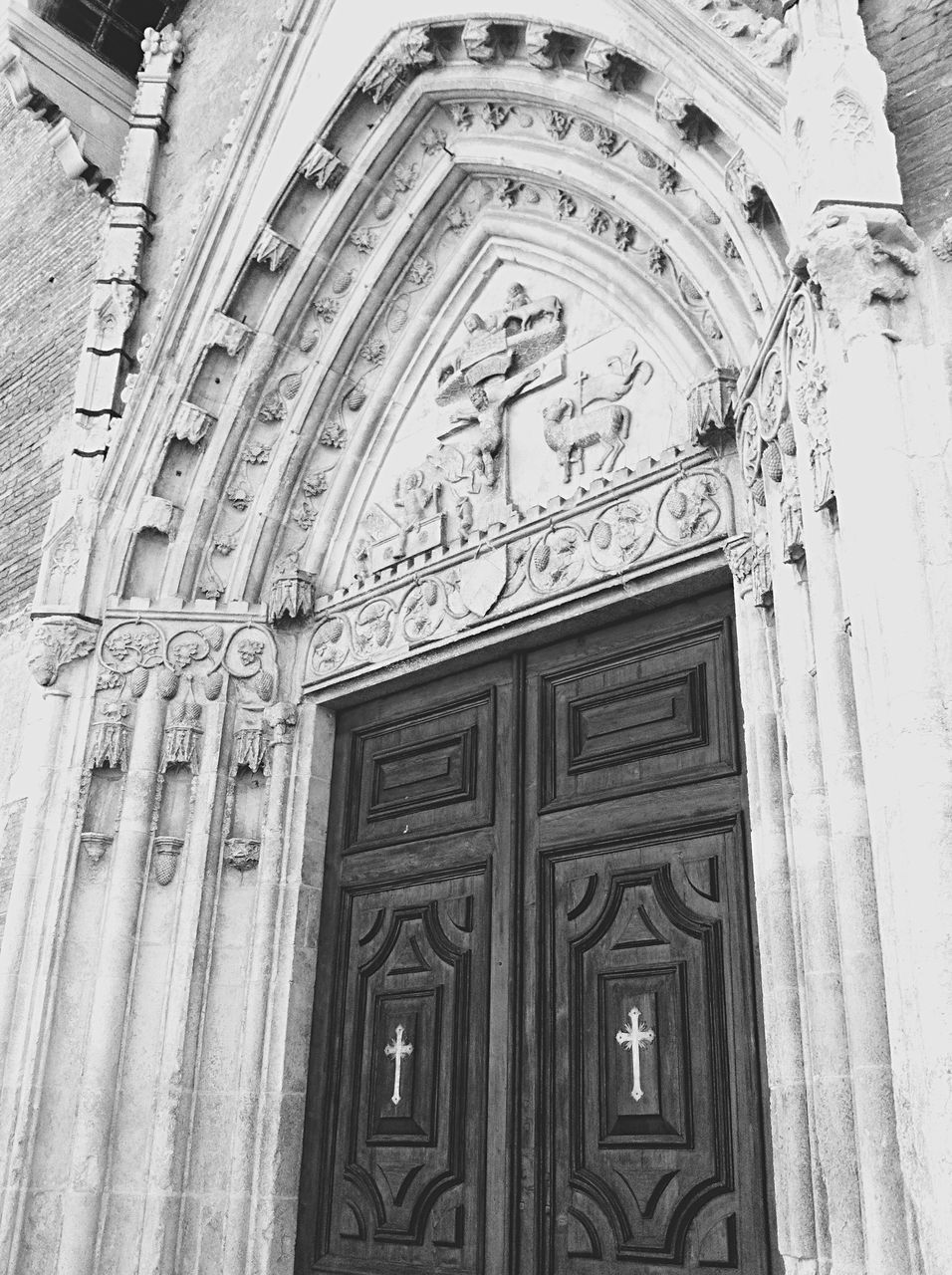 architecture, built structure, building exterior, art and craft, low angle view, ornate, carving - craft product, art, religion, door, church, creativity, arch, history, design, place of worship, facade, human representation, building