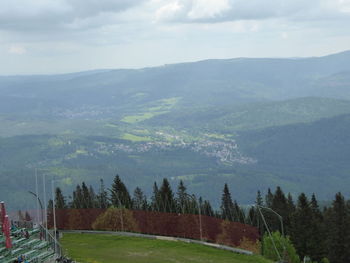 Scenic view of landscape and mountains against sky