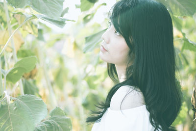 Side view of a young woman
