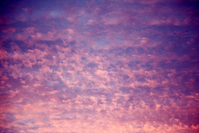 Low angle view of clouds in sky at sunset