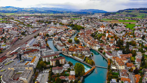 High angle view of river amidst buildings in city