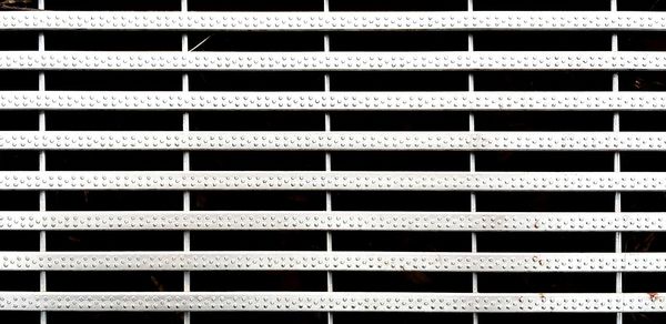 Full frame shot of metal grate