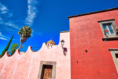 Low angle view of building against blue sky