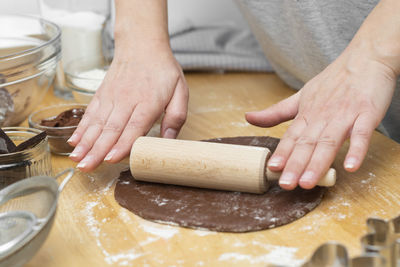 Midsection of person preparing food on table