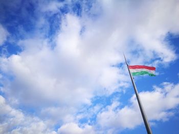 Low angle view of flag against sky