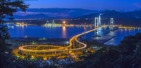 High angle view of illuminated hakucho bridge over river during night