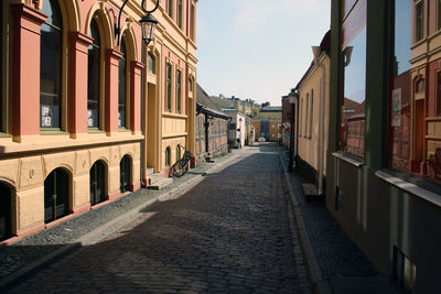 Narrow alley amidst buildings in town