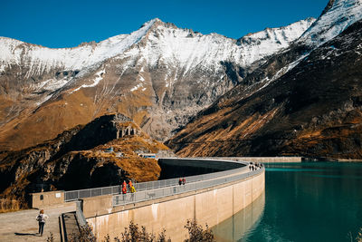 Scenic view of snowcapped mountains against clear sky
