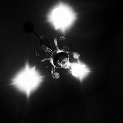 Low angle view of illuminated light bulb