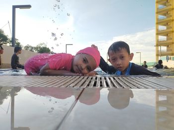 Portrait of children and daughter outdoors