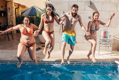 People enjoying in swimming pool