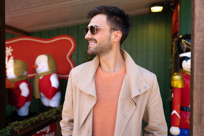 Low angle view of young man wearing sunglasses