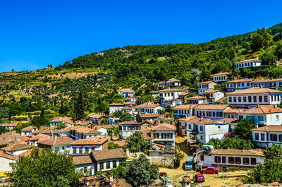 Houses in town against clear sky