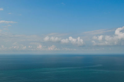 Scenic view of sea against blue sky