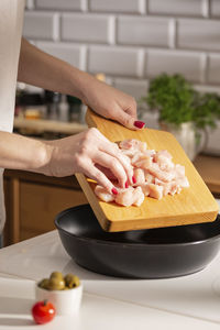 Frying teriyaki chicken on a pan
