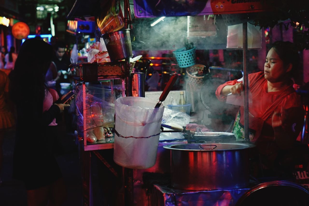 MIDSECTION OF WOMAN WITH DRINK