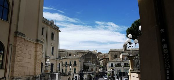 Buildings in city against sky