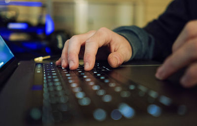 Close up of a hands of a businessman on a keyboard. 