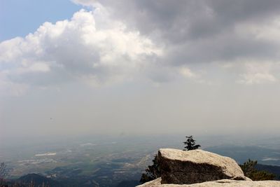 Scenic view of rocks on mountain against sky