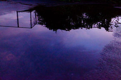 Scenic view of tree against sky at dusk