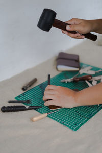 Midsection of woman working on table