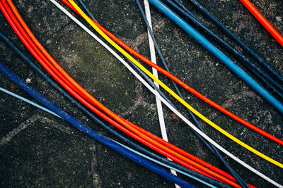Close-up of colorful cables on ground