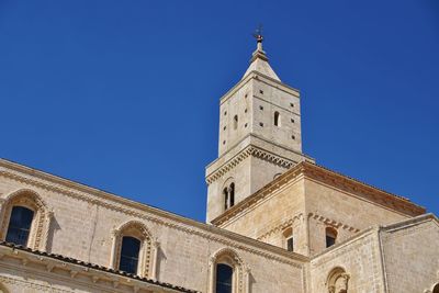 Low angle view of church against clear blue sky