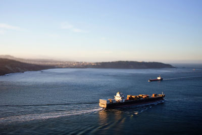 High angle view of boats on sea against sky