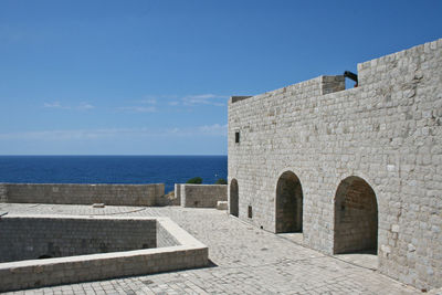 View of built structures against blue sky