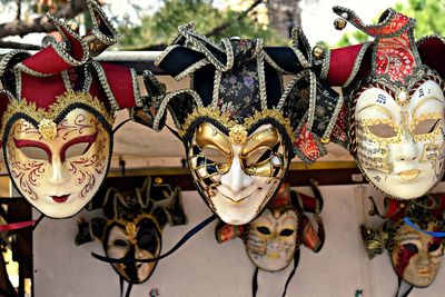 Close-up of masks for sale at market stall