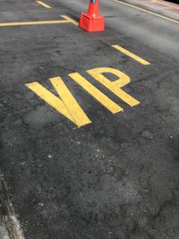 High angle view of vip text on road in city