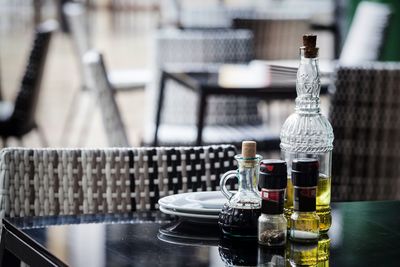 Close-up of wine bottles on table