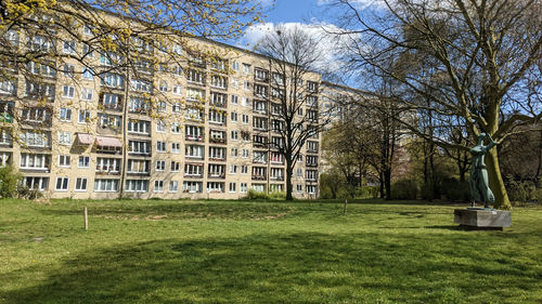 Built structure on field by lawn against sky