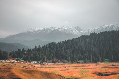 Scenic view of snowcapped mountains against sky