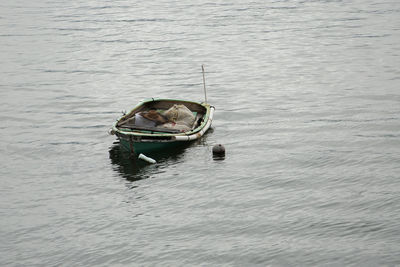 High angle view of fishing boat moored at lake