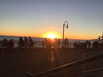 People on beach at sunset