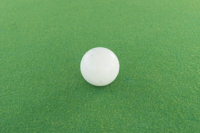 High angle view of ball on green table