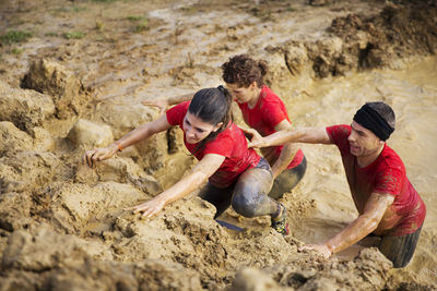 High angle view of team crossing mud pit during race