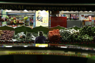 Group of people in market stall