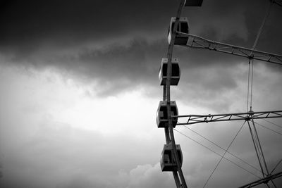 Low angle view of crane against sky